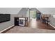 Open bonus room featuring a wet bar, desk space, and an exterior door to the outside at 1001 Foxcroft Rd, James Island, SC 29412