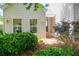 Home's exterior view showcasing charming details, windows, and lush landscaping at 1001 Foxcroft Rd, James Island, SC 29412