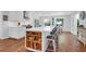 Spacious kitchen with white cabinets, a large island, and modern appliances, perfect for cooking at 1001 Foxcroft Rd, James Island, SC 29412