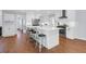 Stylish kitchen featuring a large island, white cabinetry, and stainless steel appliances, ideal for entertaining at 1001 Foxcroft Rd, James Island, SC 29412
