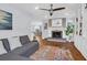 Open-concept living room showcasing fireplace, built-ins, and seamless flow to the kitchen at 1001 Foxcroft Rd, James Island, SC 29412
