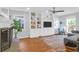 Cozy living room with built-in shelving, fireplace, and lots of natural light at 1001 Foxcroft Rd, James Island, SC 29412