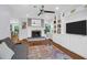 Inviting living room with fireplace, custom built-ins, and hardwood flooring at 1001 Foxcroft Rd, James Island, SC 29412