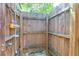 Private outdoor shower with wood enclosure and dual shower heads at 1001 Foxcroft Rd, James Island, SC 29412