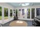 Bright sunroom with skylight, multiple windows, and access to the outdoor patio at 1001 Foxcroft Rd, James Island, SC 29412