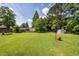 A spacious, tree-lined backyard, offering room for recreation and relaxation at 104 Clover St, Summerville, SC 29483