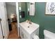Stylish bathroom with bright white fixtures, gold accents, and a modern vanity, offering a luxurious and updated space at 104 Clover St, Summerville, SC 29483
