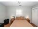Spacious bedroom featuring natural light, two side tables with lamps, and hardwood floors, creating a cozy and inviting atmosphere at 104 Clover St, Summerville, SC 29483