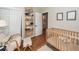Cozy Bedroom with natural wood accents, a crib, and ample storage, perfect for a warm and inviting space at 104 Clover St, Summerville, SC 29483