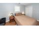 Serene bedroom featuring light gray walls and wooden floors, creating a relaxing ambiance with soft lighting at 104 Clover St, Summerville, SC 29483