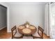 Bright dining area featuring a round wooden table with decorative place settings and four chairs at 104 Clover St, Summerville, SC 29483