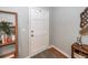 Bright entryway with a white door, wood floors, decorative accents, and stylish shelving at 104 Clover St, Summerville, SC 29483
