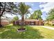 Charming single-story brick home with well-manicured lawn and mature landscaping at 104 Clover St, Summerville, SC 29483