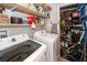 Spacious laundry room with modern washer and dryer, open shelving and room for storage at 104 Clover St, Summerville, SC 29483