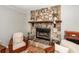 Charming living room with a stone fireplace, comfortable seating, and rustic accents at 104 Clover St, Summerville, SC 29483