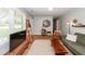 Bright living room with a TV, wooden accents, and plenty of natural light at 104 Clover St, Summerville, SC 29483
