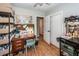 View of a home office featuring hardwood floors, a desk, and built-in shelving for storage at 104 Clover St, Summerville, SC 29483