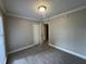 Bedroom with carpet, neutral walls, closet, and bright natural light at 106 Pelican St, Ladson, SC 29456