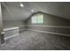 A cozy bonus room featuring neutral paint, soft carpeting, and a window for natural light at 106 Pelican St, Ladson, SC 29456