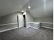 Carpeted bonus room features a door and white trim for a clean, finished look at 106 Pelican St, Ladson, SC 29456