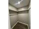 Walk-in closet featuring ample shelving and modern laminate flooring for organized storage solutions at 106 Pelican St, Ladson, SC 29456