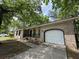 Lovely brick home with an attached garage and a neat, paved driveway at 106 Pelican St, Ladson, SC 29456