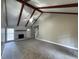 Spacious living room featuring vaulted ceilings, exposed beams, and a brick fireplace at 106 Pelican St, Ladson, SC 29456