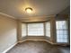 Bright living room featuring neutral walls and large bay window offering plenty of natural light at 106 Pelican St, Ladson, SC 29456