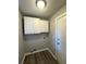 Mud Room with overhead cabinets and wood-look vinyl flooring at 106 Pelican St, Ladson, SC 29456