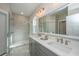 Modern bathroom features double sinks, marble floors, glass shower, and brushed nickel fixtures at 109 Gray Pine Ln, Summerville, SC 29483