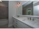 Bathroom featuring dual sinks, quartz counters, and a modern lighting fixture at 109 Gray Pine Ln, Summerville, SC 29483