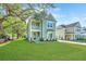 Charming two-story home featuring a covered porch, balcony, and landscaped front yard at 109 Gray Pine Ln, Summerville, SC 29483