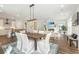 Open-concept living space with modern lighting, hardwood floors, and comfortable seating at 109 Gray Pine Ln, Summerville, SC 29483
