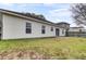Backyard view with a sliding glass door leading to the patio and green space at 109 Wisteria Ct, Summerville, SC 29486