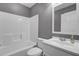 Bathroom featuring a tub, toilet, white sink, and gray walls at 109 Wisteria Ct, Summerville, SC 29486