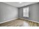 Empty bedroom featuring modern flooring, a window with blinds, and neutral paint at 109 Wisteria Court Ct, Summerville, SC 29486