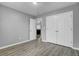 Bedroom featuring modern flooring, neutral paint, closet, and doorway at 109 Wisteria Court Ct, Summerville, SC 29486