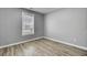 Empty bedroom showcasing modern flooring, a window with blinds, and neutral paint at 109 Wisteria Ct, Summerville, SC 29486