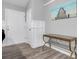 Inviting entryway with stylish flooring, decorative molding, and console table beneath an ocean-themed artwork at 109 Wisteria Ct, Summerville, SC 29486