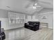 Spacious living room with vaulted ceiling and large windows providing plenty of natural light at 109 Wisteria Ct, Summerville, SC 29486
