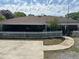 Spacious backyard featuring a concrete patio, curved walkway, and white picket fence, ideal for outdoor enjoyment at 111 Craven Rd, Ladson, SC 29456