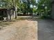 View of the backyard with gravel and chickens at 111 Craven Rd, Ladson, SC 29456