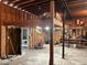 Unfinished basement with wood paneled walls and exposed ceiling at 111 Craven Rd, Ladson, SC 29456