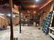 This is an unfinished basement area with ladders, tools and concrete floors at 111 Craven Rd, Ladson, SC 29456