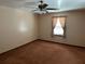 This is a simple bedroom with carpet, a ceiling fan and a window with curtains at 111 Craven Rd, Ladson, SC 29456