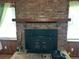 Cozy brick fireplace with a wooden mantel, offering a warm and inviting focal point in the living space at 111 Craven Rd, Ladson, SC 29456