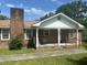 Charming brick home with a cozy front porch and classic design, perfect for relaxing in the outdoors at 111 Craven Rd, Ladson, SC 29456