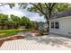 Manicured backyard features a charming shed and a patio with outdoor seating at 1199 Island View Dr, Mount Pleasant, SC 29464