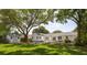 Expansive backyard featuring a well-maintained lawn, shade trees, patio, and a small outbuilding at 1199 Island View Dr, Mount Pleasant, SC 29464