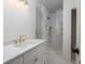 Bright bathroom features a marble countertop, gold fixtures, and a glass enclosed shower at 1199 Island View Dr, Mount Pleasant, SC 29464